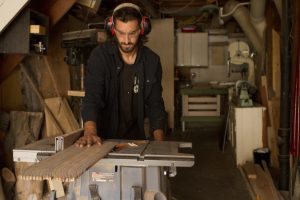 Designer Transforms old Skateboards into unique guitars and bass